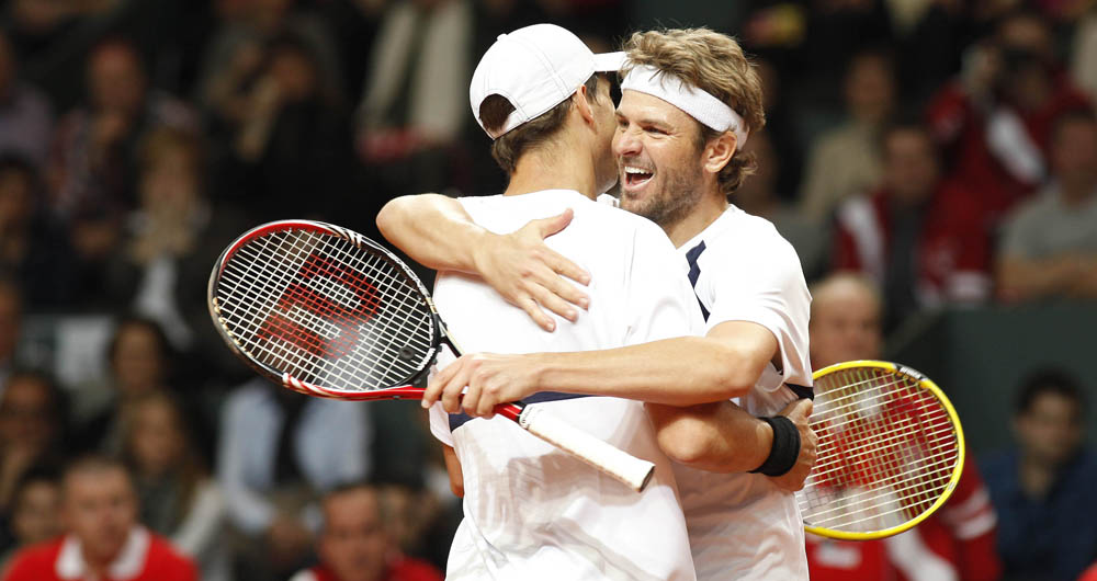   mardy fish and mike bryan of the US team During the 2012 Davis Cup tie USA vs. Switzerland, held in Fribourg Switzerland, 11. februar 2012
photo siggi bucher