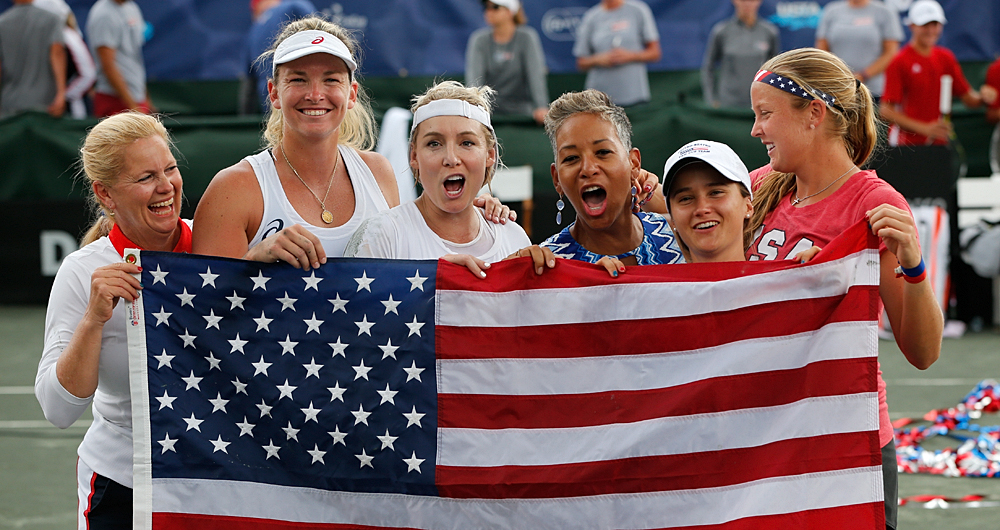 USA team members celebrate winning their FedCup matches against the Czech Republic with USTA CEO Katrina Adams at the Saddlebrook Resort on April 23, 2017 in Tampa Bay, Florida. Photo by Gary Hershorn