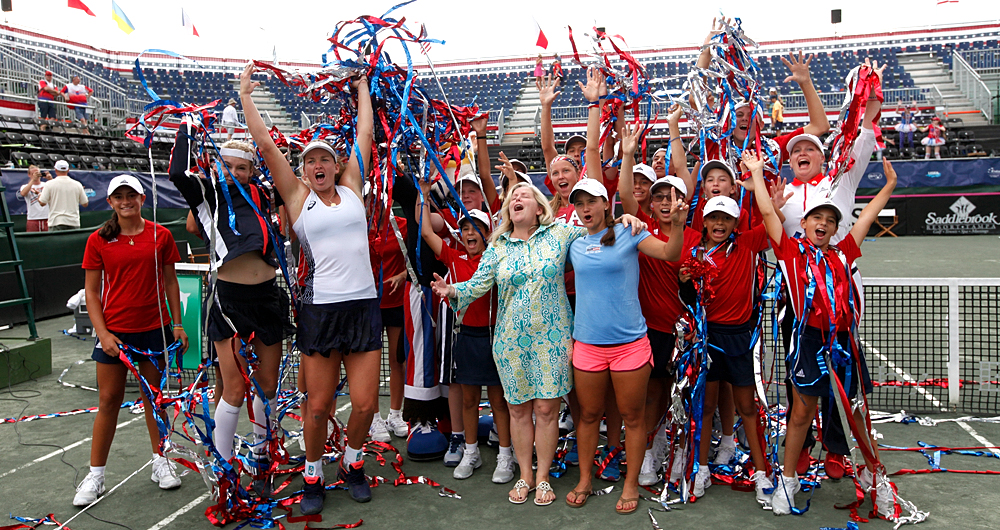 USA team members celebrate winning their FedCup matches against the Czech Republic with ballboys and girls at the Saddlebrook Resort on April 23, 2017 in Tampa Bay, Florida. Photo by Gary Hershorn