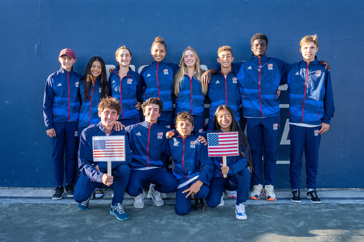 American juniors smiling and wearing USA uniforms.